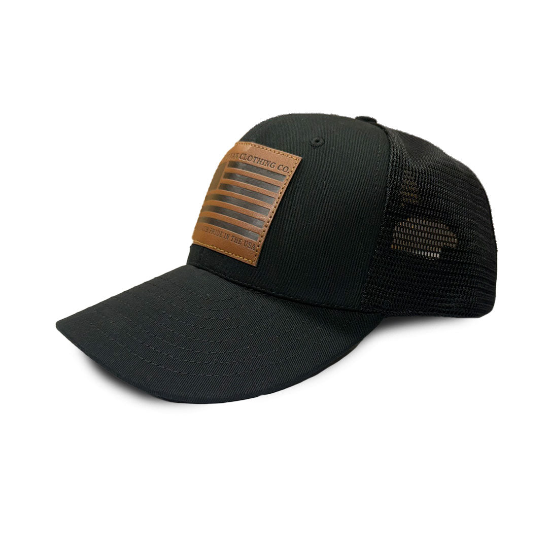 Black cap with brown leather patch on a white background