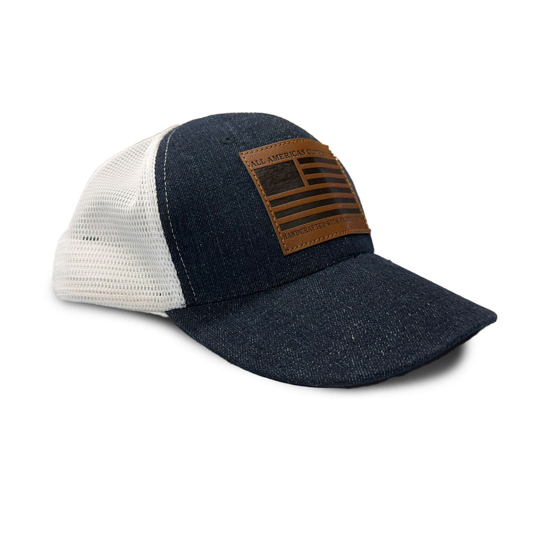 Blue and white cap with a brown leather patch on a white background