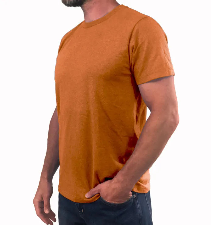 Dressing in a light orange short sleeve V neck shirt, jeans and